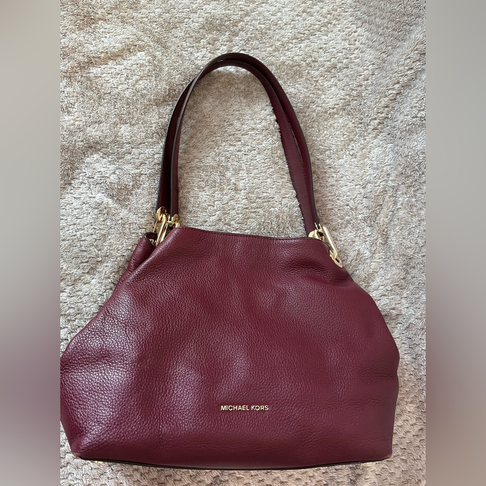 Michael Kors burgundy bag.